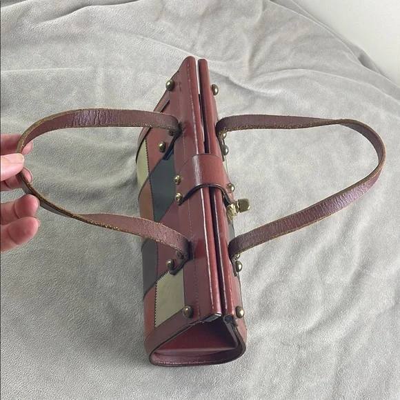 Vintage Brown Satchel with Structured Design and Metal Accents - Picture 9 of 15